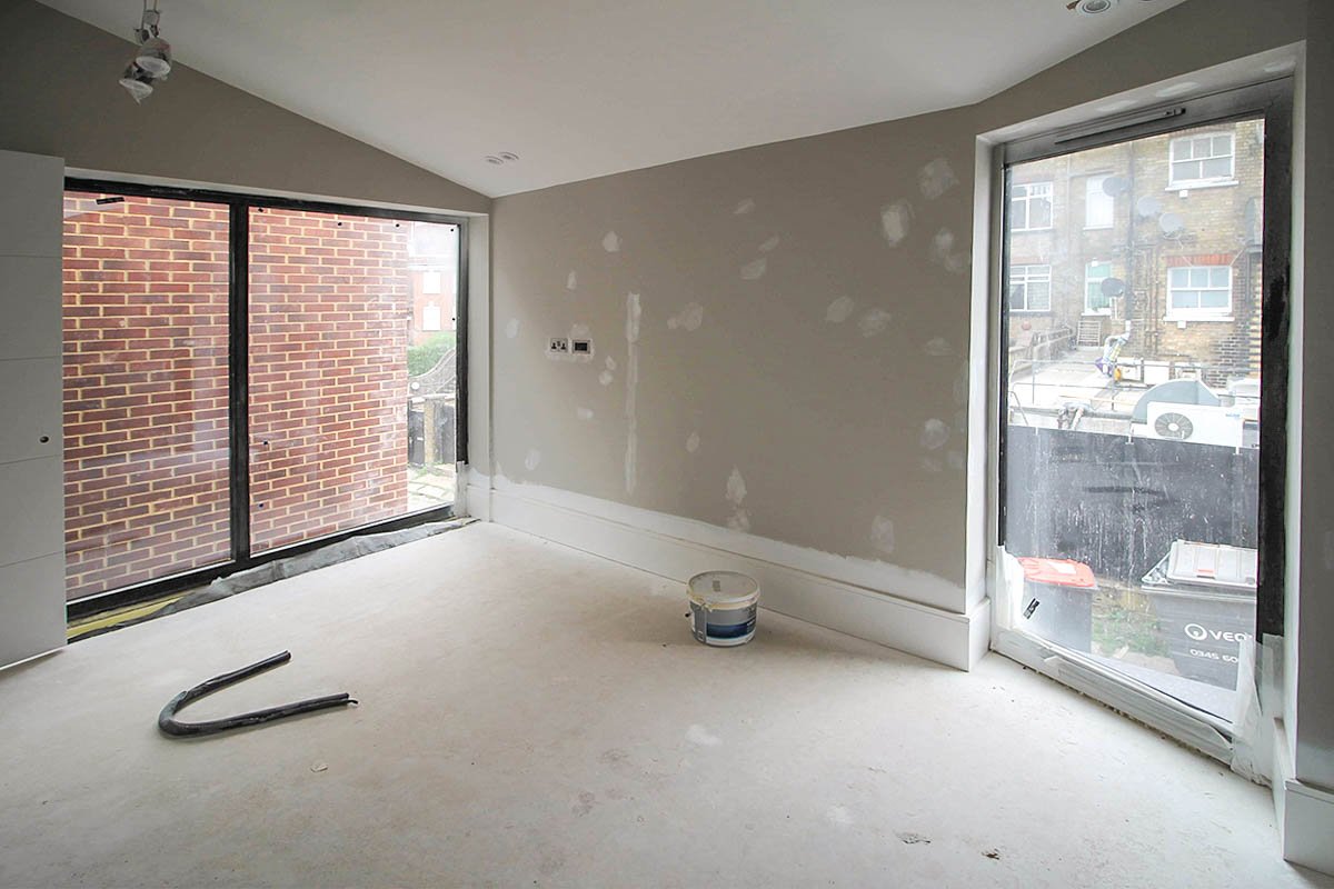 plastered and painted room Hodford Road with vaulted ceiling with two windows