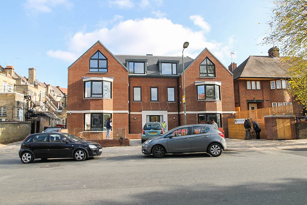 double fronted bay windows facade Hodford Road new brick building with dormer windows in zinc on Hodford Road NW11