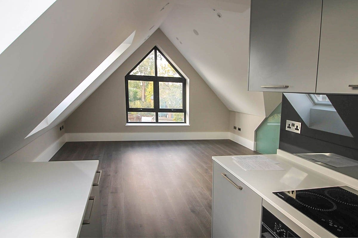 vaulted kitchen room Hodford Road with grey walls, kitchen panelling and black frame house-shaped window