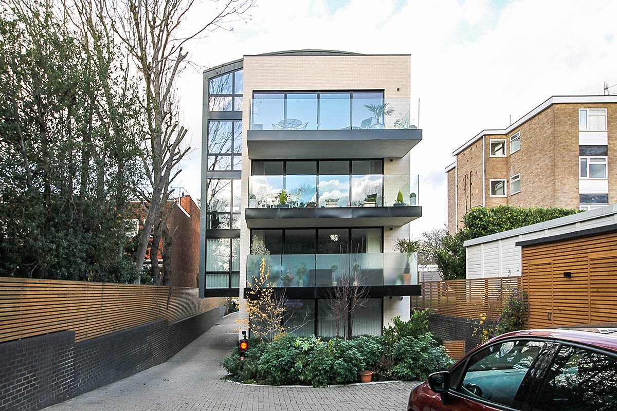 facade white brick building balconies rear 55 Woodside Park Road