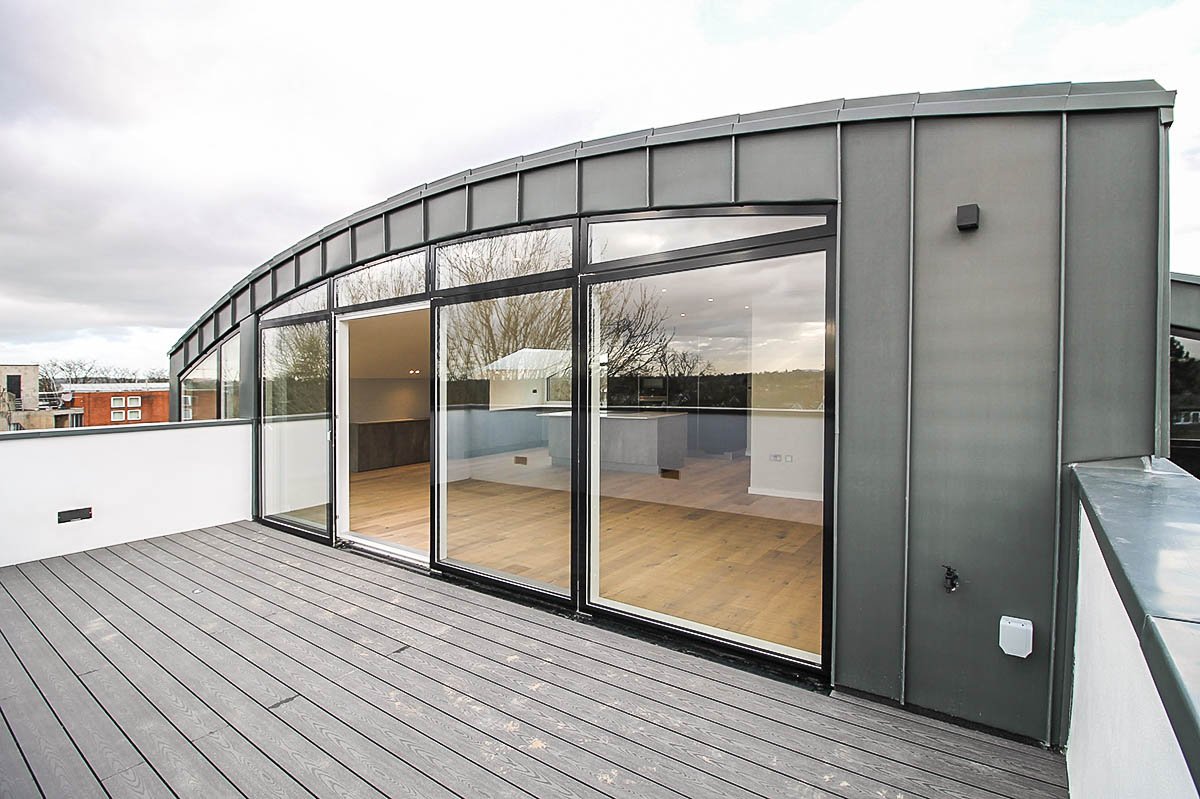 zinc roof curved roof and glass Construction 55 Woodside Park Road