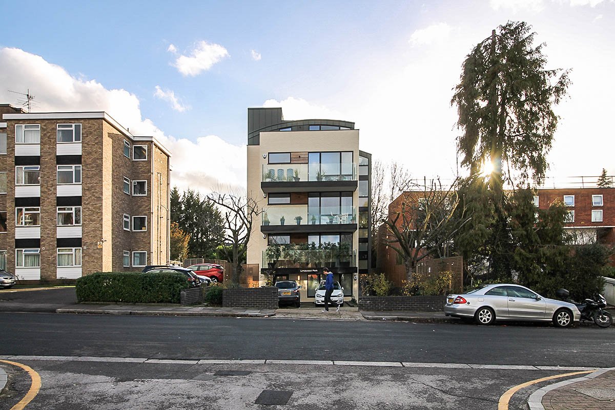 facade white brick Building construction front 55 Woodside Park Road